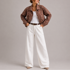 Women's cropped bomber jacket with high neck in brown polka dot, front detail
