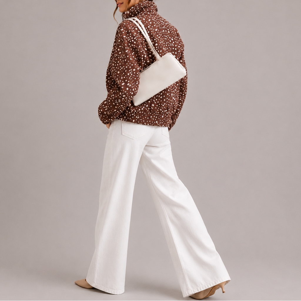 Women's cropped bomber jacket with high neck in brown polka dot, back view