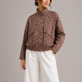 Women's cropped bomber jacket with high neck in brown polka dot