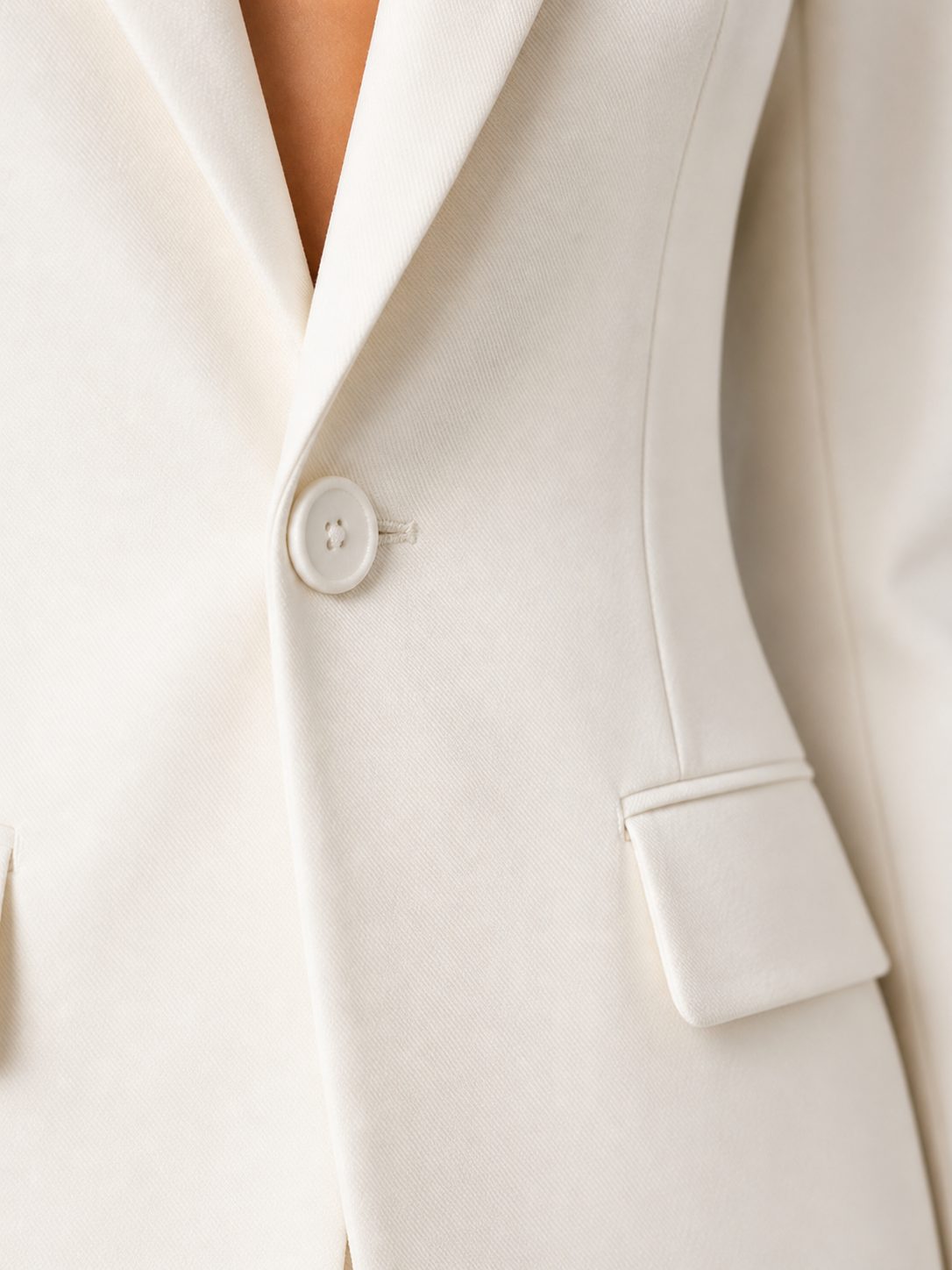 White tailored blazer and wide-leg trouser set, side view