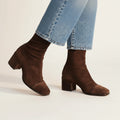 Brown suede block heel ankle boots, angled view