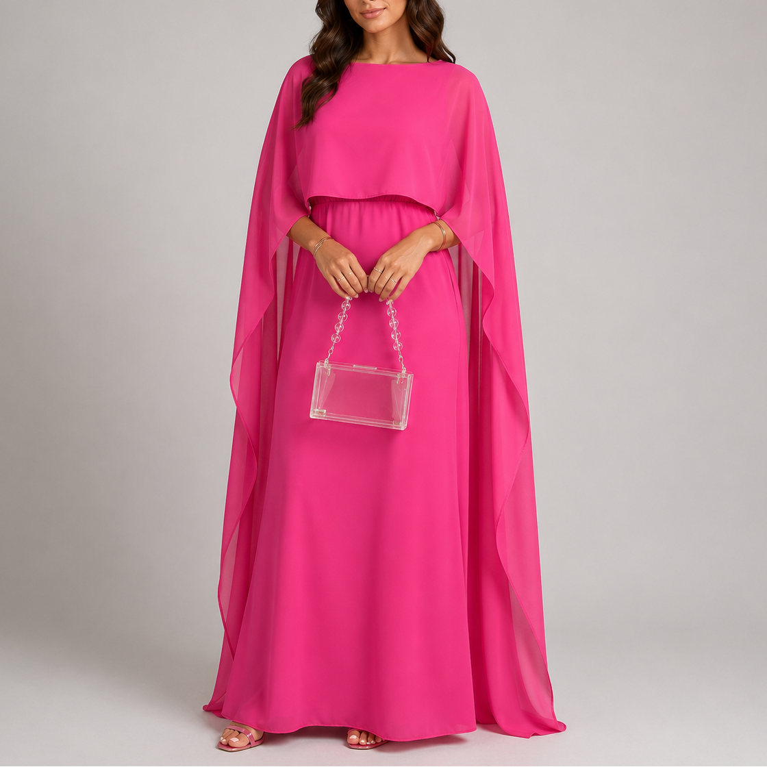 Draped cape maxi dress showing relaxed floor-length silhouette