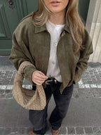 Faux suede bomber jacket showing the structured shirt collar