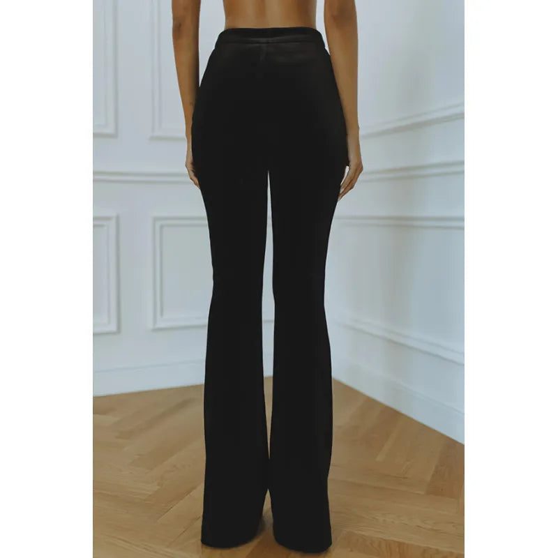 Flared velvet trousers showing wide leg opening