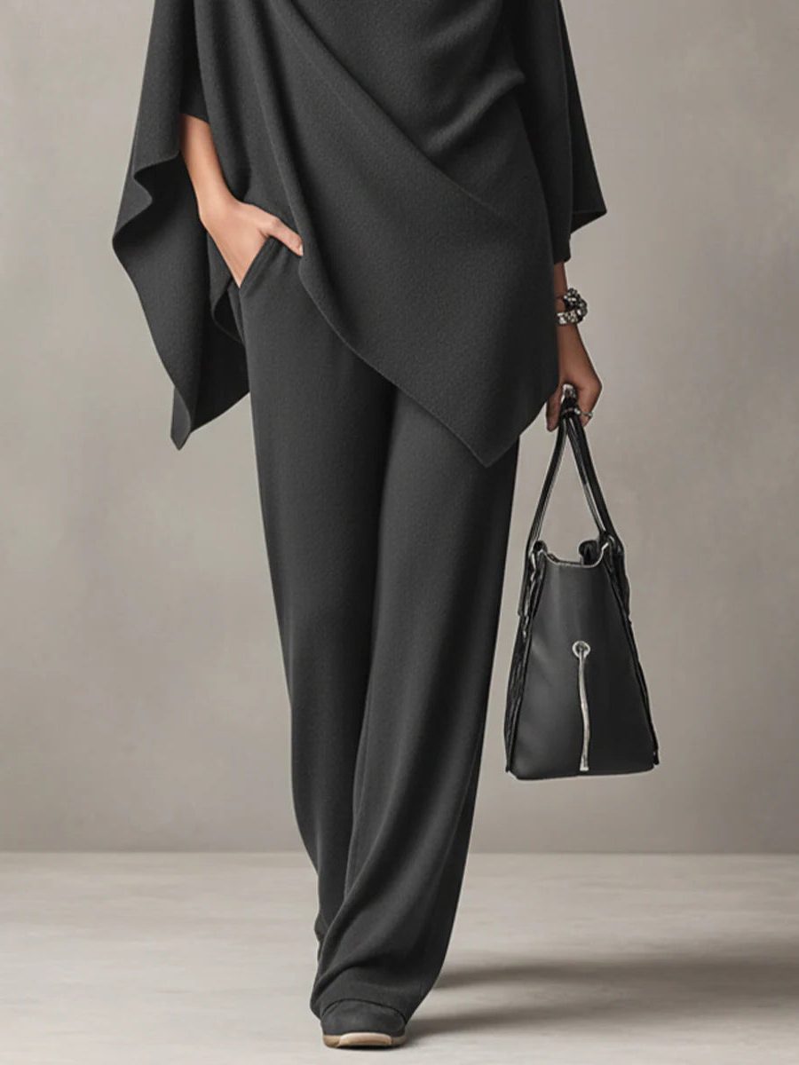 Knitted cowl-neck co-ord set with asymmetrical hem shown on a model