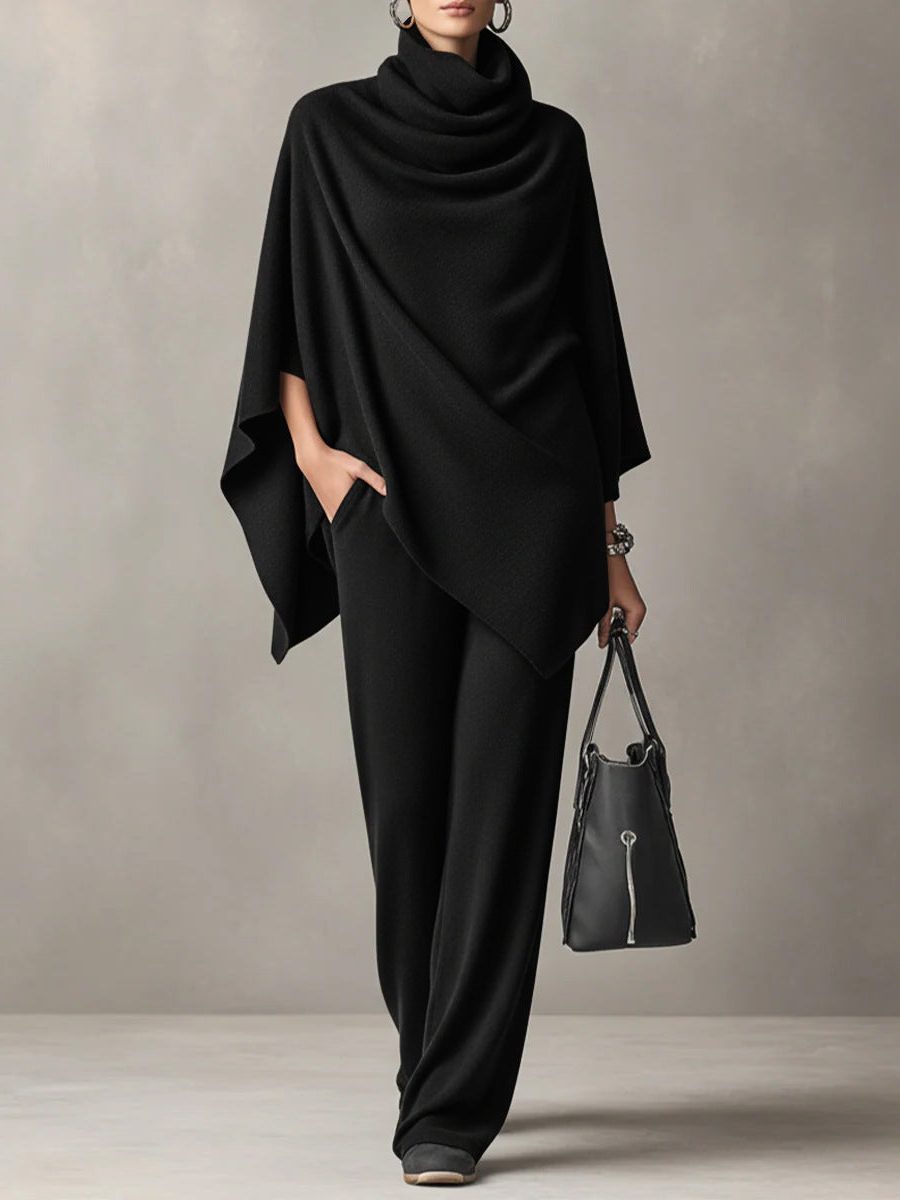 Woman wearing a knitted cowl-neck co-ord set with wide-leg trousers, front view