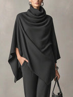 Full-length view of a knitted cowl-neck co-ord set with wide-leg trousers