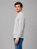 Men's collared knit sweater with ribbed cuffs shown on model, side view