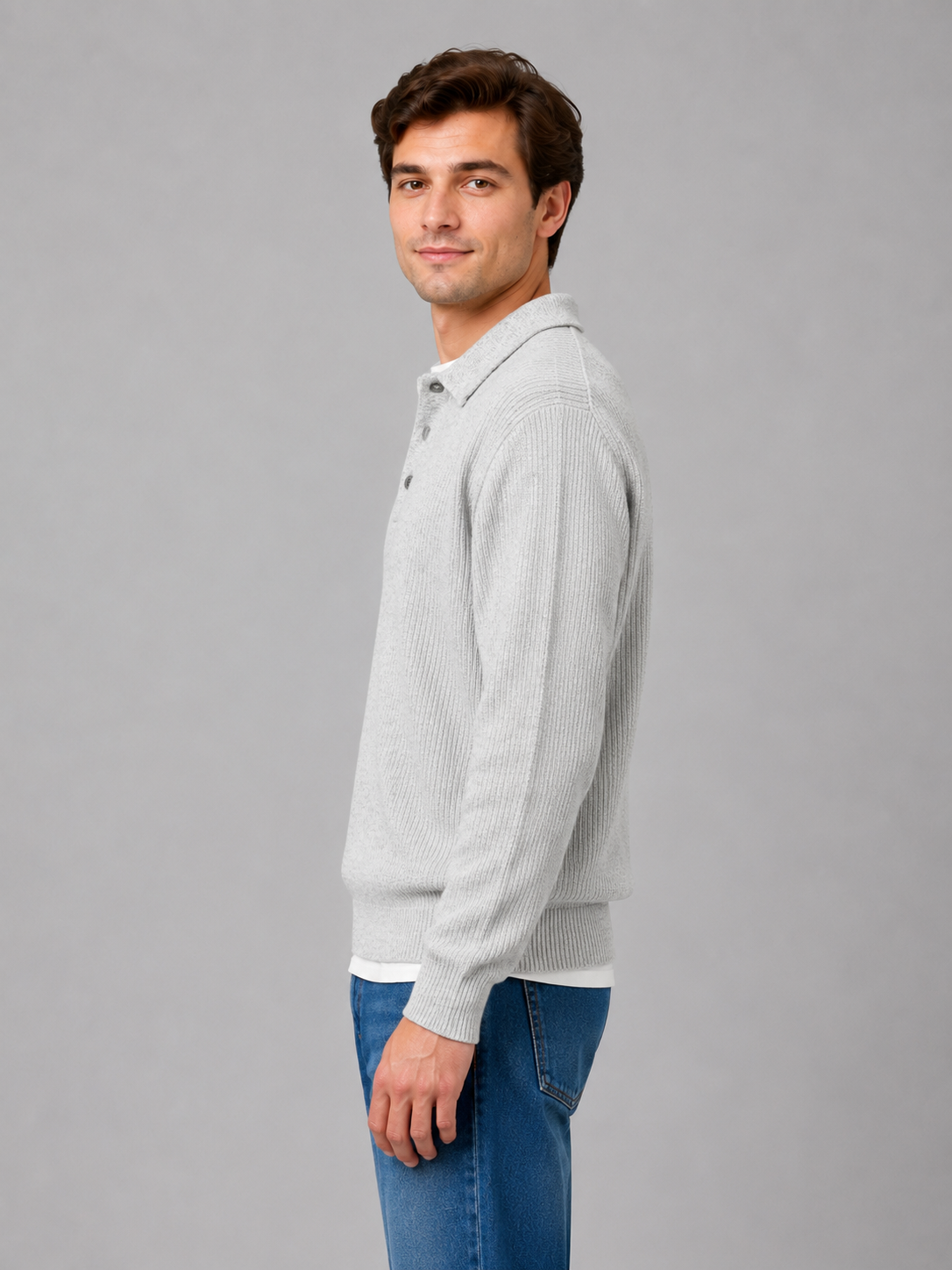 Men's collared knit sweater with ribbed cuffs shown on model, side view