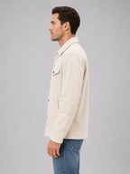 Men's corduroy overshirt jacket worn open over knitwear