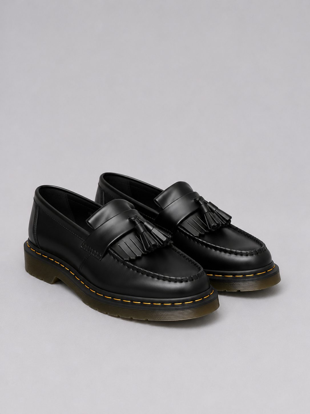 Men's black slip-on tassel loafer with low heel