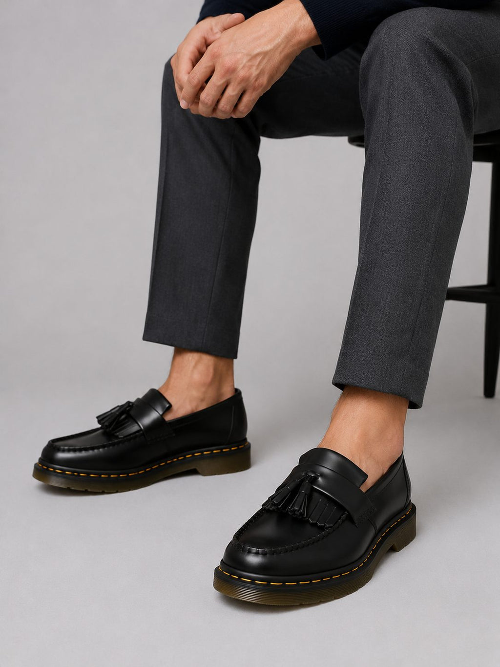 Side view of men's black tassel loafer