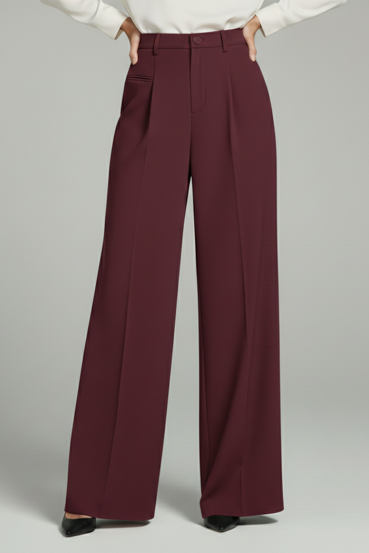 Model wearing flowing wide-leg palazzo trousers with front pleats