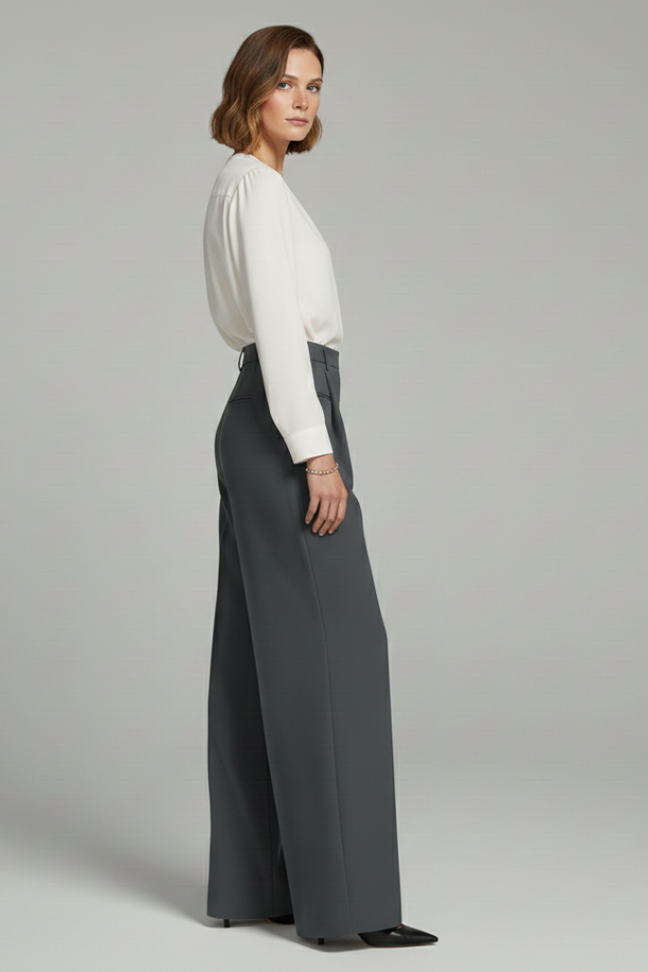 Wide-leg pleated palazzo trousers on a model, side view