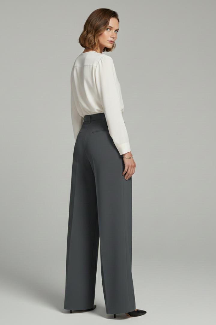 Model wearing high-waisted palazzo trousers with front pleats