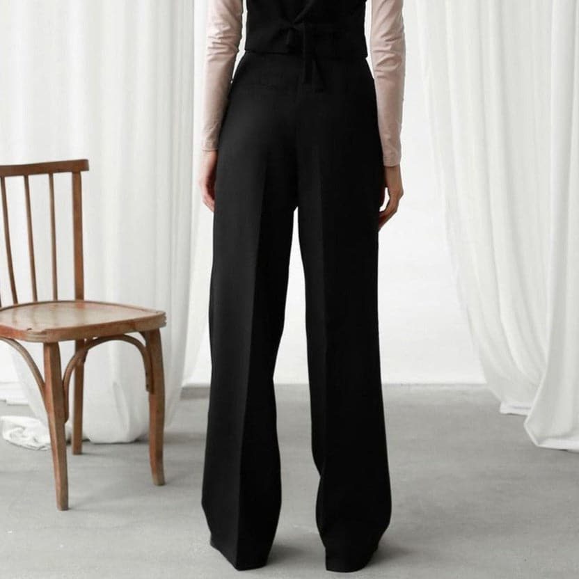 Pleated wide-leg trousers shown in green, brown and black