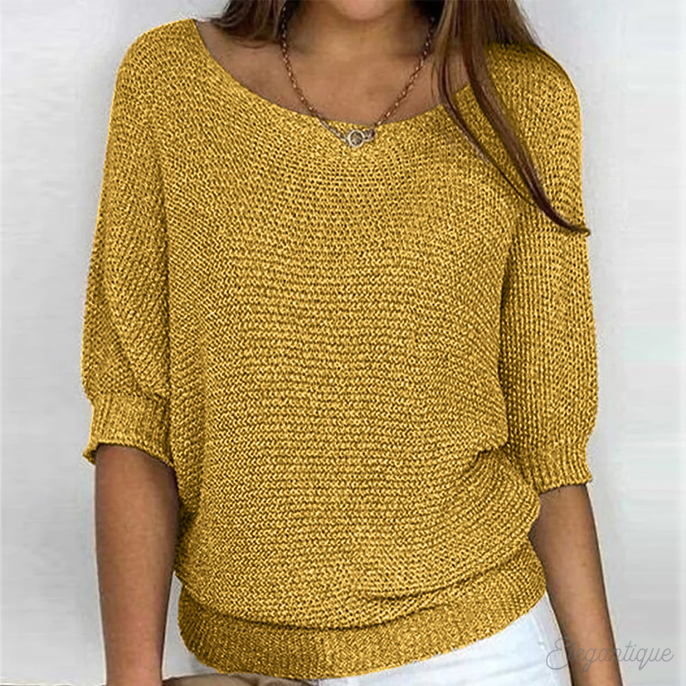 Back view of a relaxed round-neck knit sweater