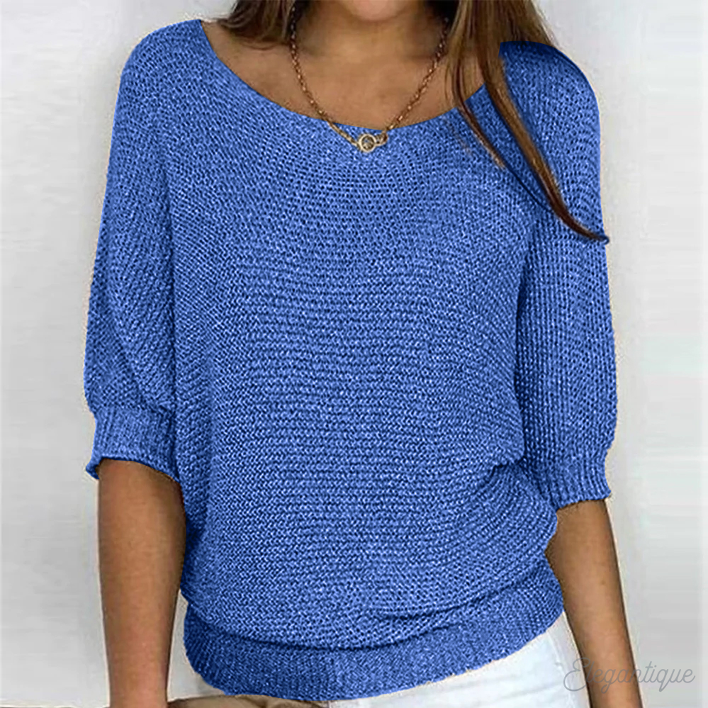 Detail of the wide sleeve and ribbed cuff on a knit sweater