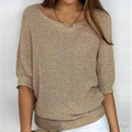 Woman wearing a relaxed round-neck knit sweater with wide sleeves, front view