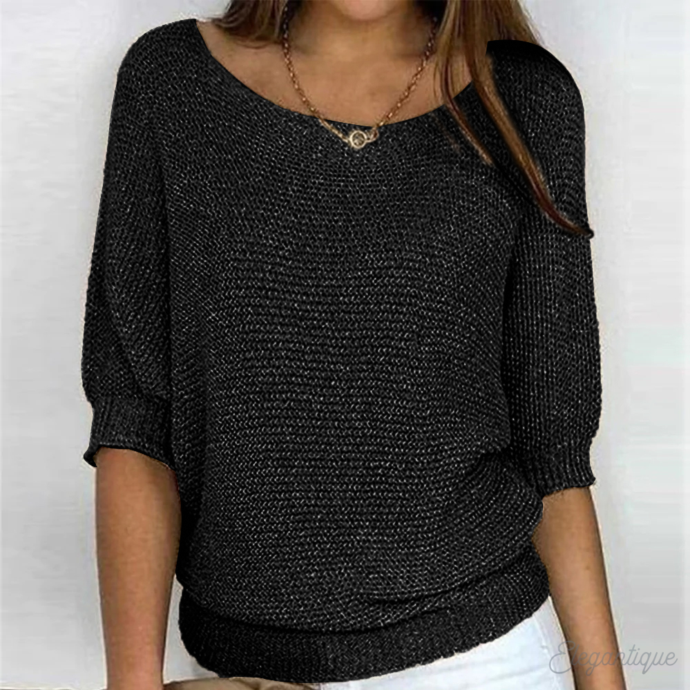 Relaxed round-neck knit sweater shown on a model