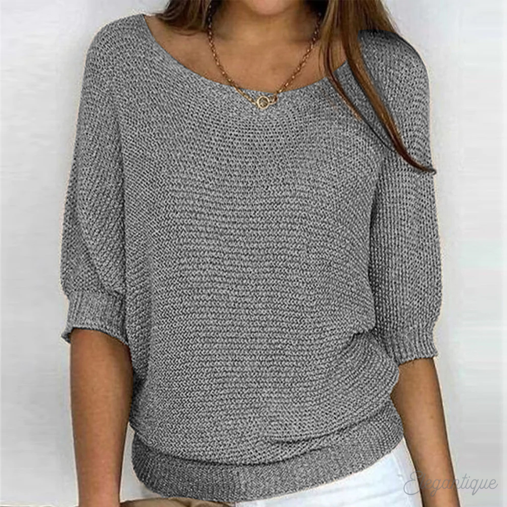 Close-up of the round neckline on a relaxed knit sweater