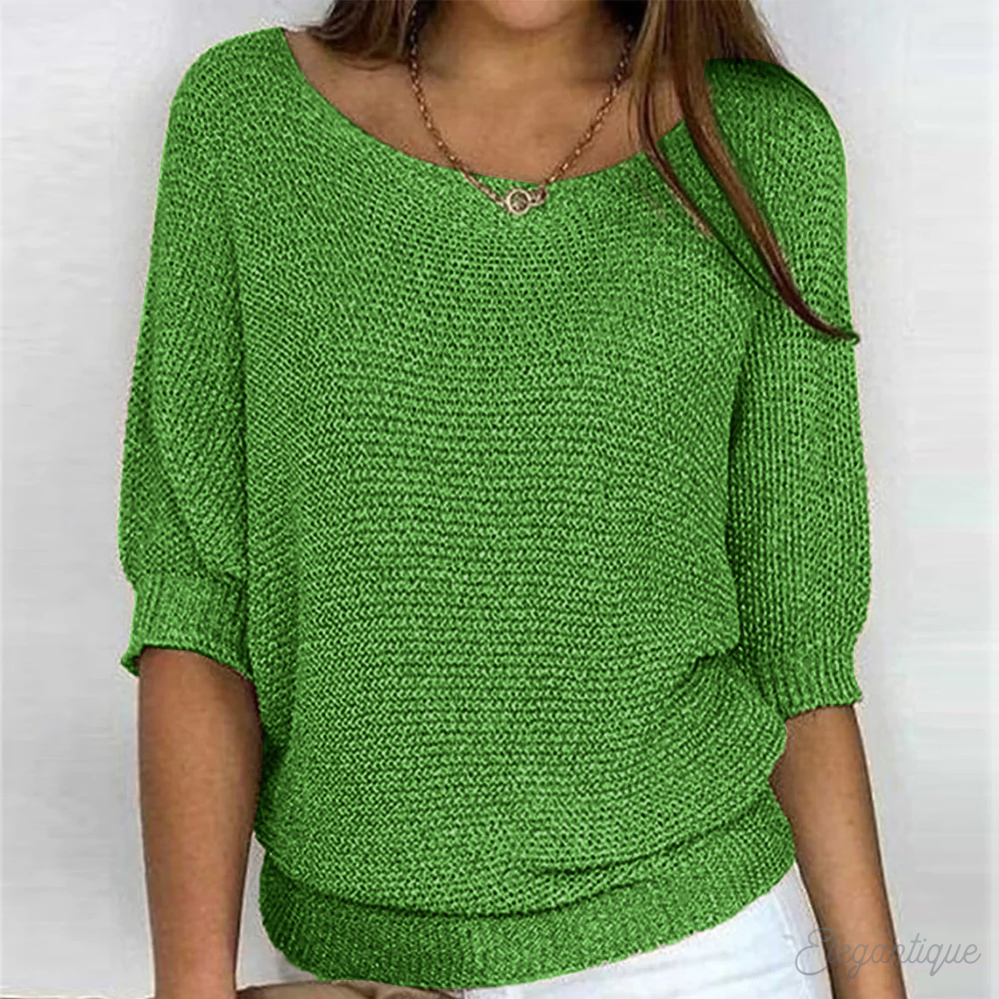 Relaxed open-weave knit sweater shown on a model