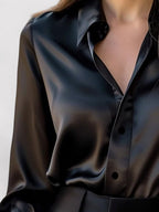 Satin blouse showing collar and button detail