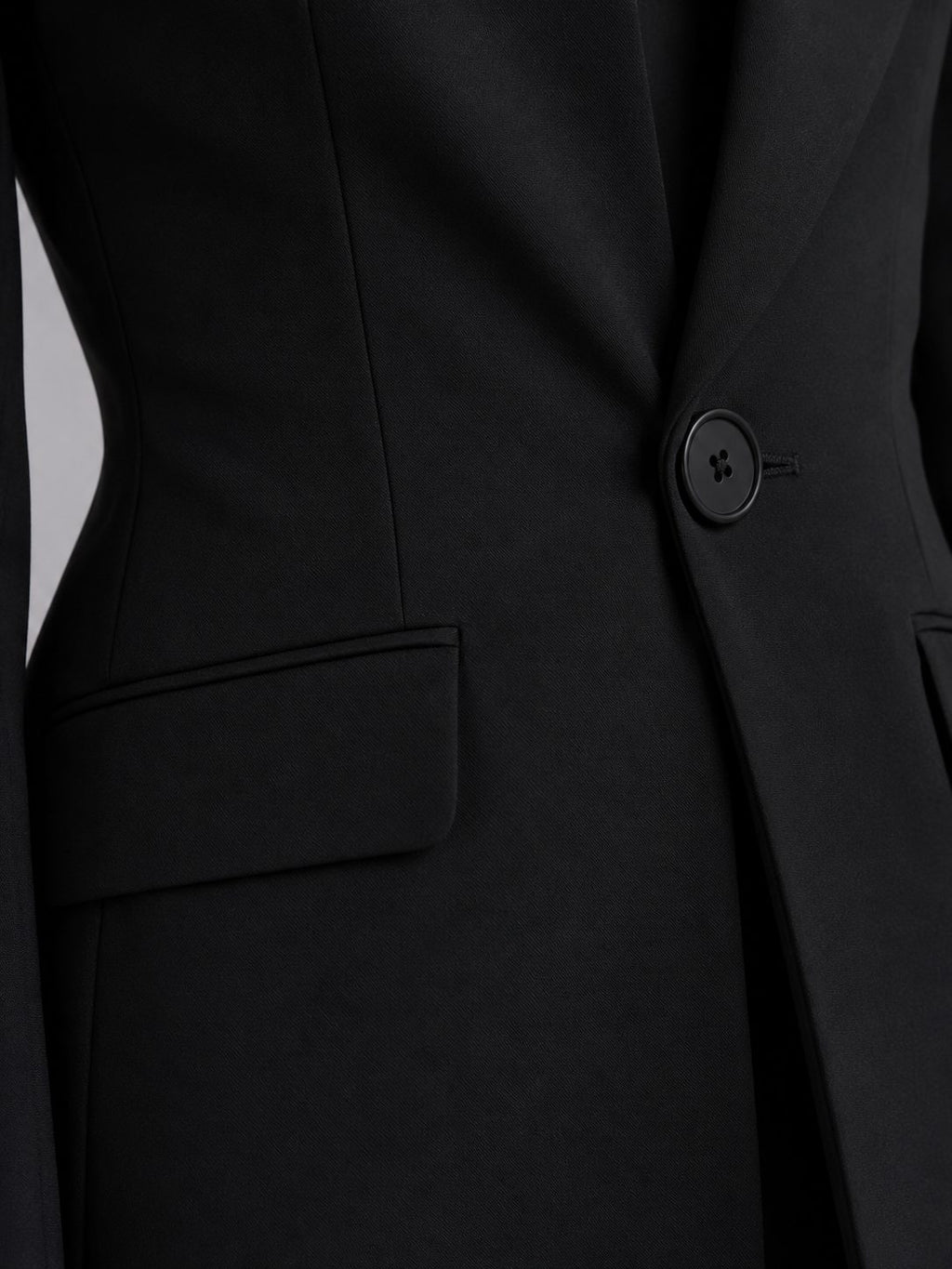 Black single-breasted blazer and flared trouser set, detail view