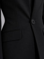 Black single-breasted blazer and flared trouser set, detail view