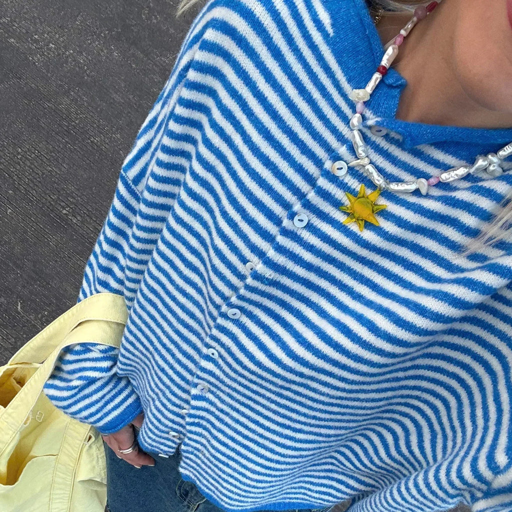 Striped button-front cardigan displayed in another colourway on a model
