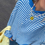 Striped button-front cardigan displayed in another colourway on a model
