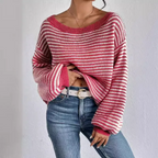 Detail of the voluminous sleeve and ribbed cuff on a knit sweater