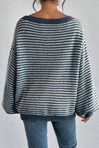 Close-up of the off-shoulder neckline on a striped knit sweater