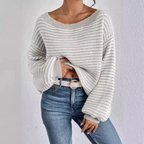 Striped off-shoulder knit sweater styled on a model