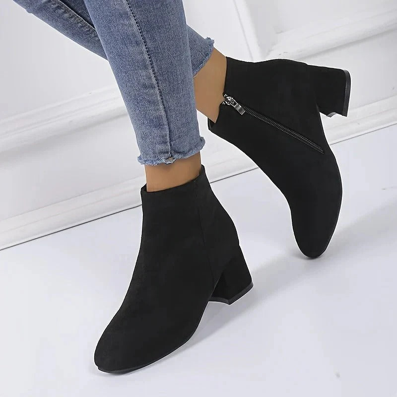Women's suede block heel ankle boots angled view