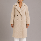 Woman wearing a long double-breasted teddy faux fur coat