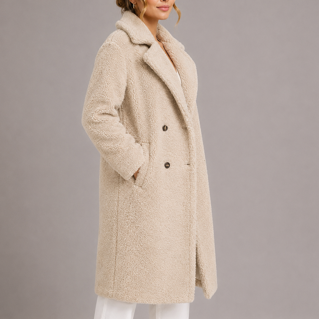 Longline teddy faux fur coat shown on a model