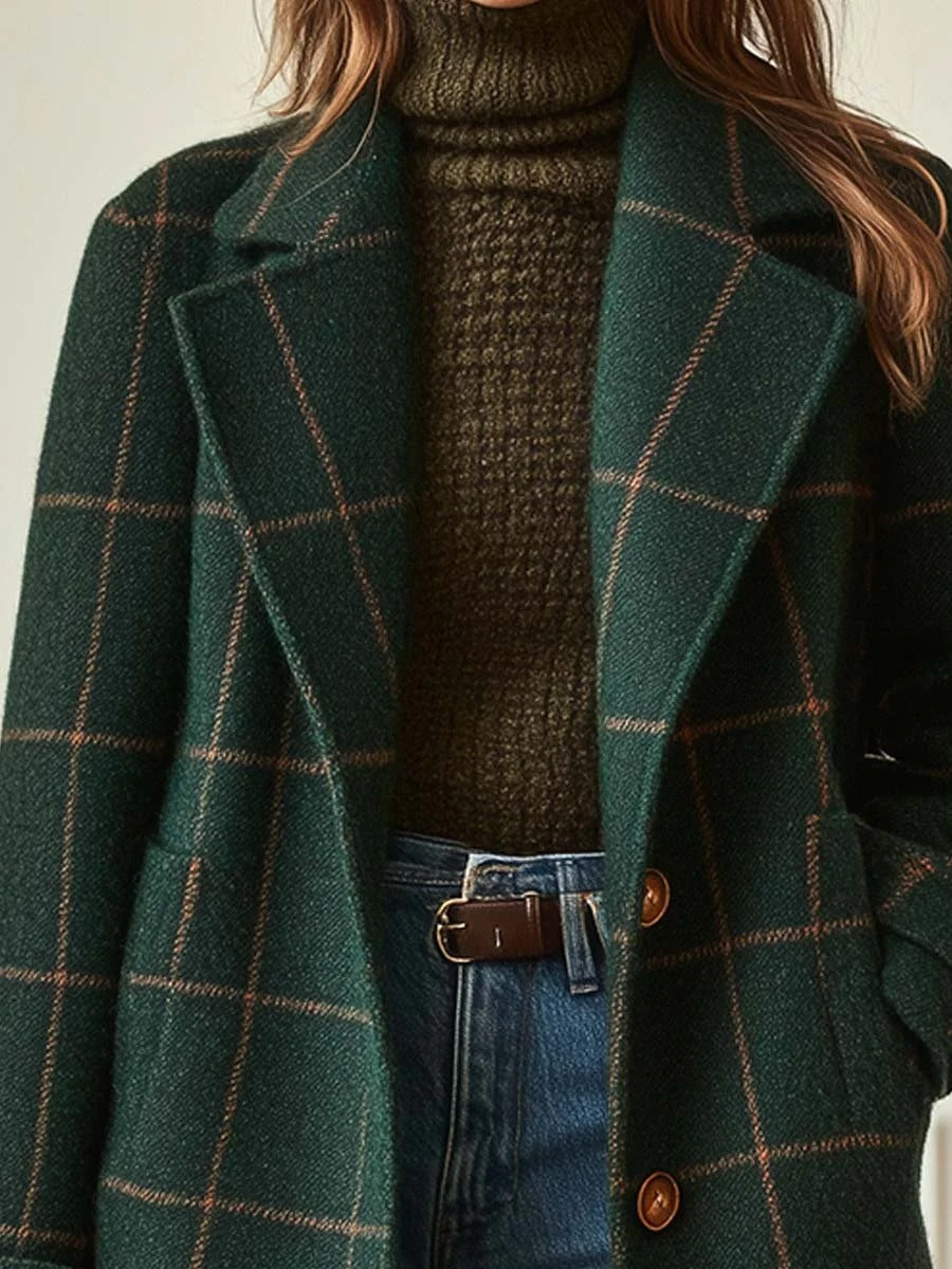 Detail of a windowpane check coat with button front