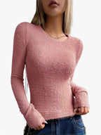 Woman wearing a ribbed knit long sleeve top