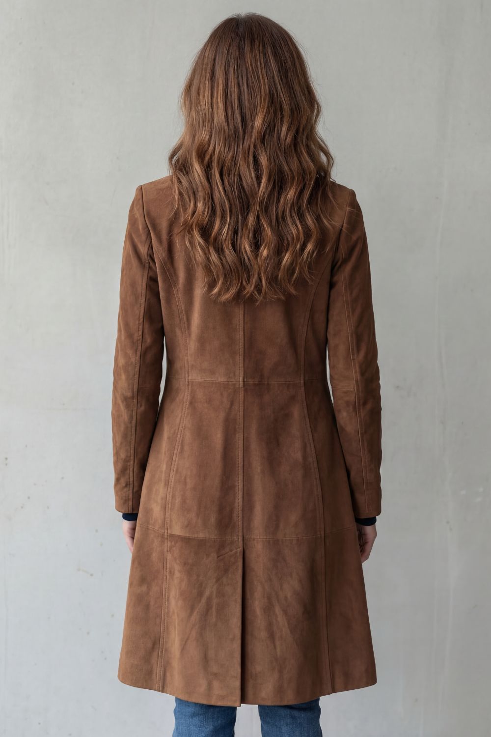 Side profile of brown longline coat with notched lapel collar