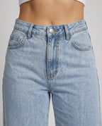 Close-up detail of soft-touch denim wide-leg jeans